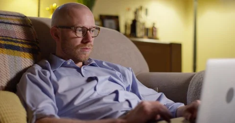 4k, Businessman using a laptop while working from home. Stock Footage 128374050
