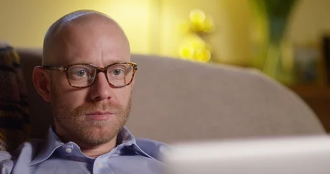 4k, Businessman using a laptop while working from home. Stock Footage 128377068