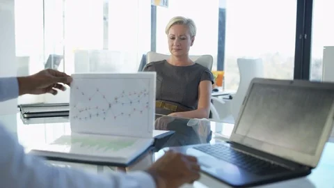 4K Businesswoman in a meeting with her manager, explaining financial data Stock Footage
