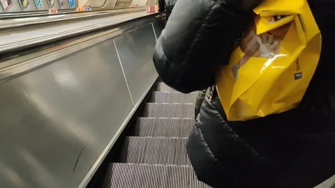 4K, Busy commuters rushing down escalator with bag Stock Footage 123872262