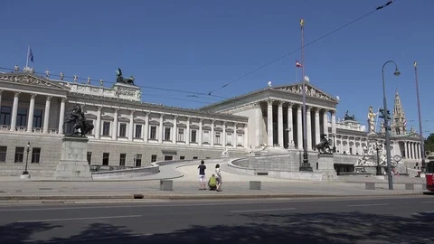 4K Busy traffic street in Vienna downtown Austrian Parliament building iconic Stock Footage