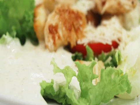 4k Caesar salad with chicken, vegetables, eggs, lettuce, sauce, parmesan cheese Stock Footage 78193351