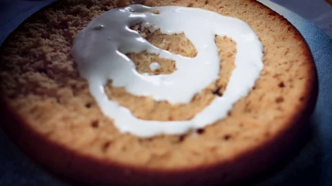 4K Cake Baker Adding Cream to Sponge as a Smiley face Video stock 74287714