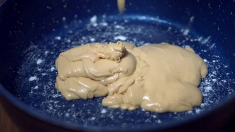 4K Cake Baker Adding Mixture Dough in Pan for Baking Video stock 74285976