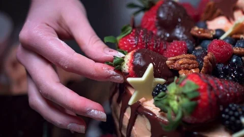 4K Cake Baker Arranging Strawberries on Top Stock Footage 74292099