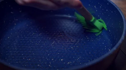 4K Cake Baker Preparing Pan with Oil for Baking Stock Footage 74285625