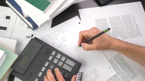 4K Calculation With Calculator And Pencil Stockbeeldmateriaal 40864056