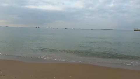 4K Calm Ocean Waves and Distant Boats on Sanya Bay Horizon Stock Footage 330989942