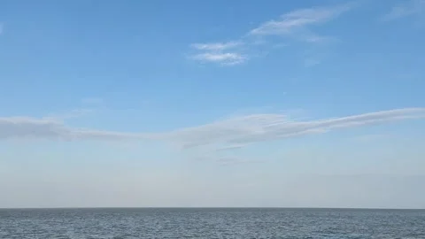 4K Calm Sea Waves Under Blue Sky and Clouds Nature Background Stock Footage 337830395