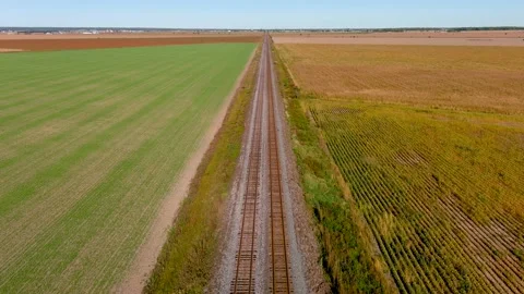 4K camera drone flying over rail road tracks in rural area. Stock Footage 162924521