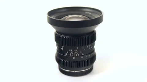 4k - Camera lens rotating on white background Stock Footage 71896342