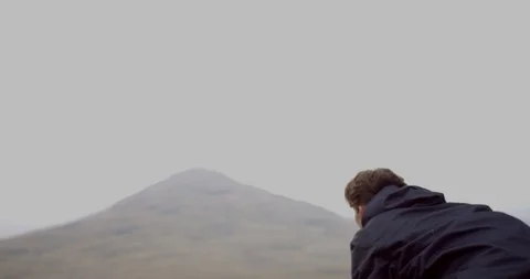 4K Camera Man in the Scottish Glen Coe Mountain Highlands. Photographer. Stock Footage 93027989