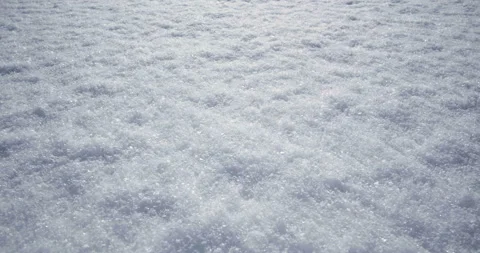 4K - Camera move across fresh snow cover. View at daytime light at winter Stock Footage 154661037