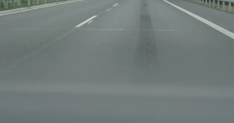 4k camera moving above asphalt road close up low angle view fast speed car  Stock Footage 95165129