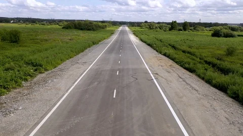 4k camera moving above asphalt road close up low angle view fast speed car Stock Footage 113548628