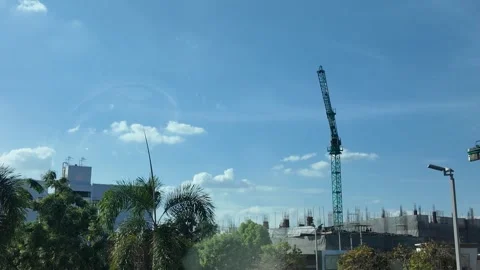 4K Camera video of construction crane operating at building site Stock Footage 325720528