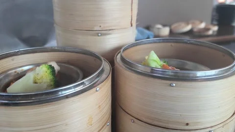 4K Camera video of dim sum served in bamboo steamers Stock Footage 325720652