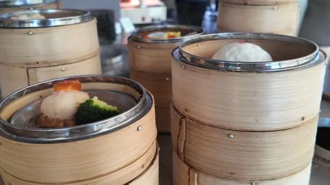4K Camera video of dim sum served in bamboo steamers Stock Footage 325720653