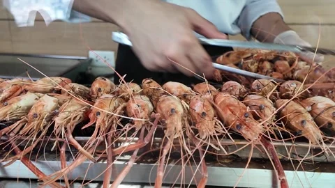 4K Camera video of grilled river prawns being cooked on charcoal stove Stock Footage 325720595