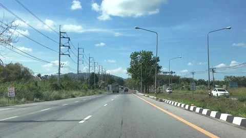 4K Camera video of highway road with clear blue sky during daytime Stock Footage 325720472