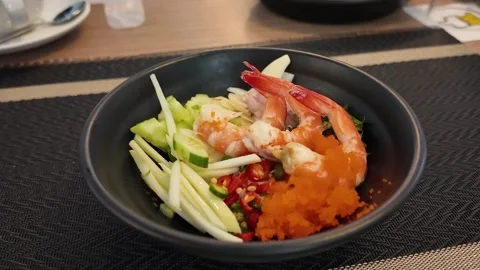 4K Camera video of spicy Thai seafood salad in black bowl  Description: Stock Footage 325720703