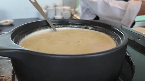 4K Camera video of sticky rice coconut milk with durian in pot Stock Footage 325720657