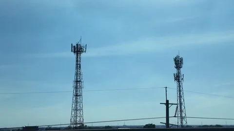 4K Camera video of telecommunication towers under clear sky Stock Footage 325720480
