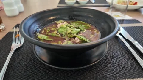 4K Camera video of Thai boat noodles served in black bowl Stock Footage 325720635