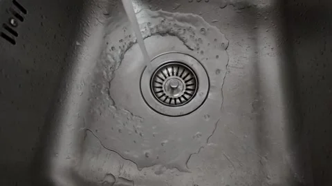 4K Camera video of water running into stainless steel sink Stock Footage 325720546