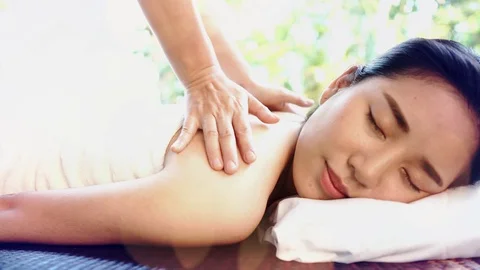 4k Camera zoom in Happy Young Asian Thai woman get massage on a bed in  Stock Footage 87738113