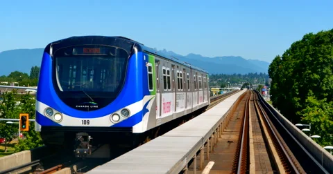 4K Canada Line Skytrain Passes by Camera, Moving Shot Stock-Footage 51947262
