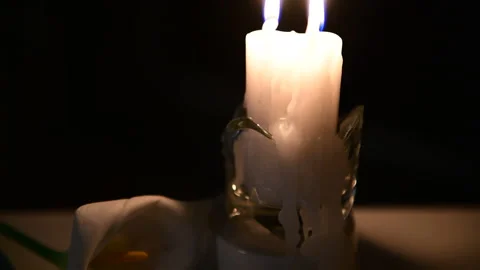 4k The candle is burning, on the table lies a notebook with verses Stock Footage 156758299