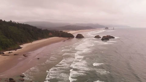 4K Cannon Beach Waves Flowing into shoreline Ecola State Park Aerial Stock Footage 111114184