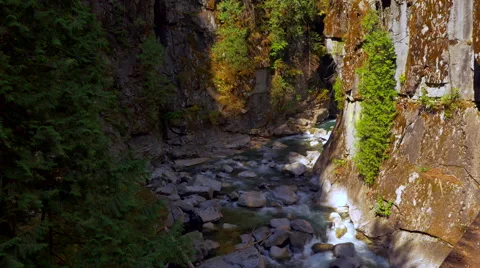 4K Canyon River, Dark Ledges and River Stone Stock Footage 67443298