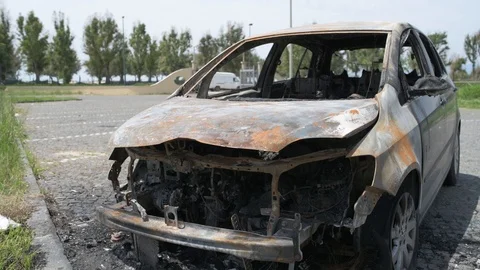 4K car completely wasted by an explosion Stock Footage 90844673