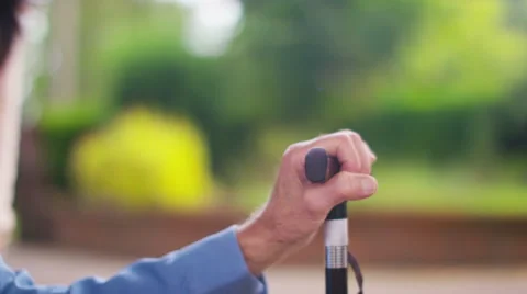 4K Caring home support worker holding the hand of elderly man with walking stick Stock Footage 56338384