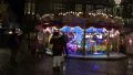 4k Carousel at Christmas market with happy people panning 4k or 4k+ Resolution