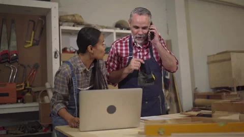 4K Carpenter couples are talking to customers online or over the phone. The.. Stock Footage 235582759