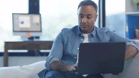 4K Casual Asian man with laptop & credit card shopping online Stock Footage