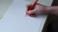 4k Caucasian hand draws an eye on white paper with a pencil 4k or 4k+ Resolution