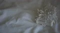 4K caucasian hand pours out cotton ear buds and picks one up from pile. 4k or 4k+ Resolution