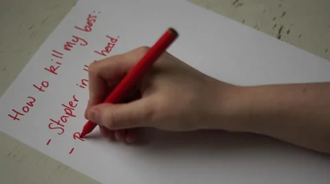 4K caucasian hand writes note on how to kill a horrible boss. Stock Footage 63130090