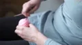 4K caucasian hands roll up a ball of pink wool and put it away 4k or 4k+ Resolution