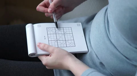 4k Caucasian hands solving a sudoku with biro pen Stock Footage 62264113