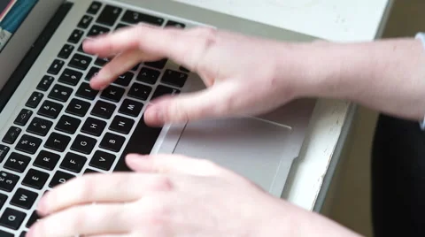 4k caucasian hands type quickly on a mac laptop on table Stock Footage 61170747