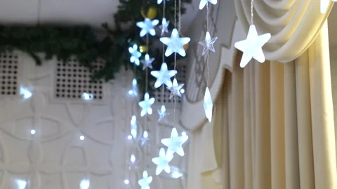 4K. The ceiling is decorated with luminous garlands in the form of a star. Stock Footage 229839356