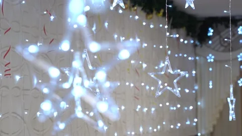 4K. The ceiling is decorated with luminous garlands in the form of a star. Stock Footage 229839387