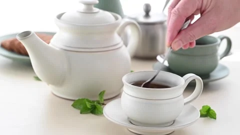4K Ceramic Tea Set Rustic Design Cream Teapot Green Mugs Stock Footage 339268034
