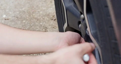 4K Changing a Tire Close Up Stock Footage 131688539