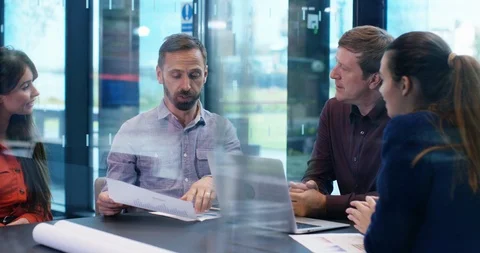 4K Cheerful business team clapping their success in a meeting Stock Footage 118726664